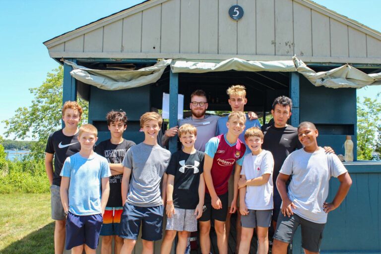 Boys in front of their cabin