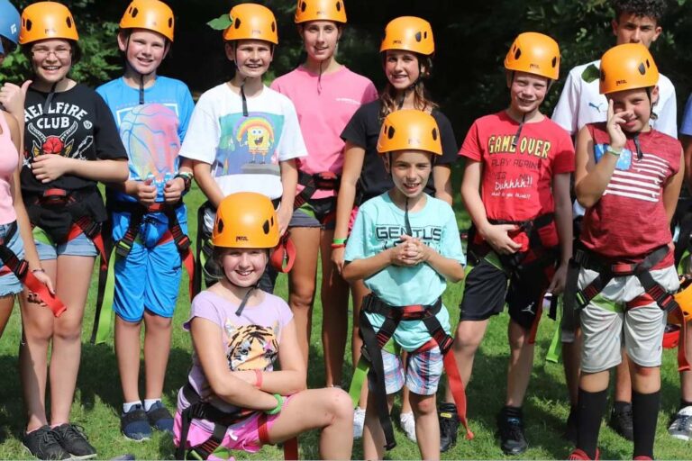 Campers wearing climbing gear