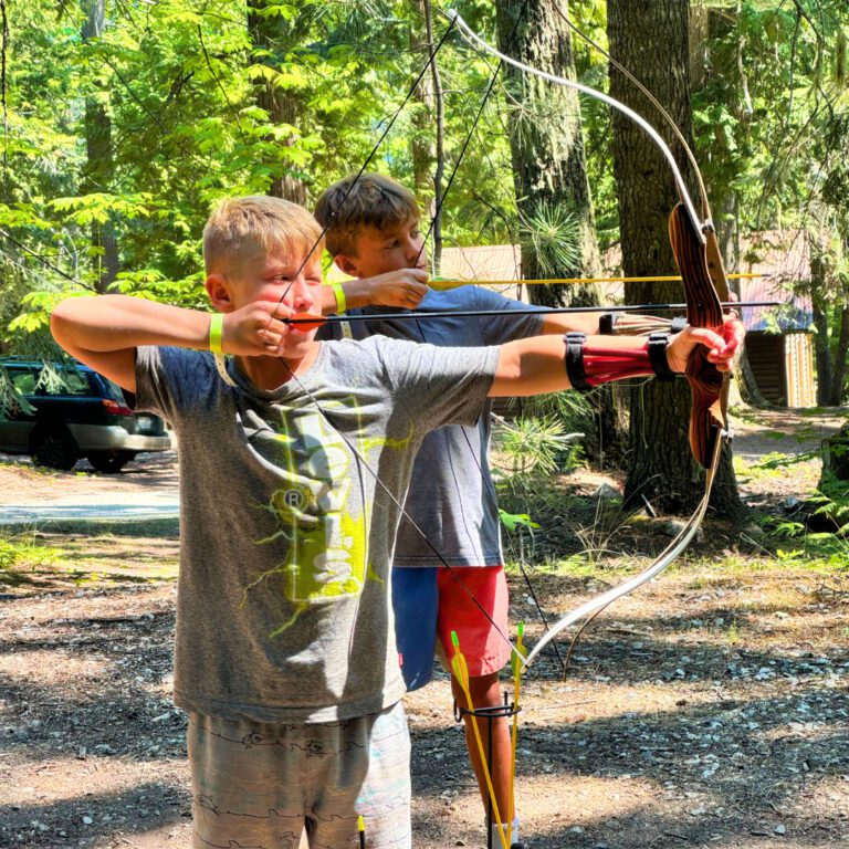 Boys with archery bows