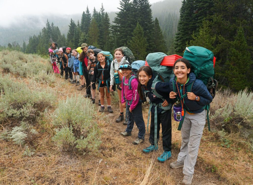 Group of teenage girls backpacking