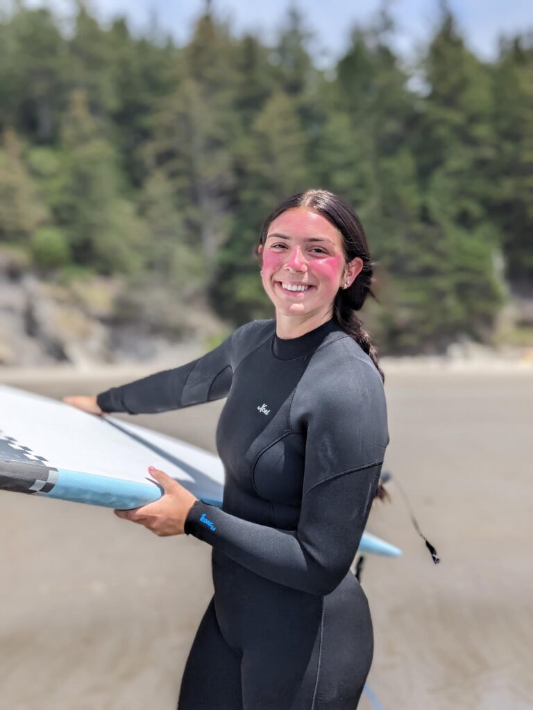 Girl holding surf board