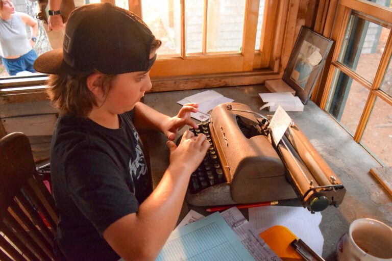 Boy using typewriter