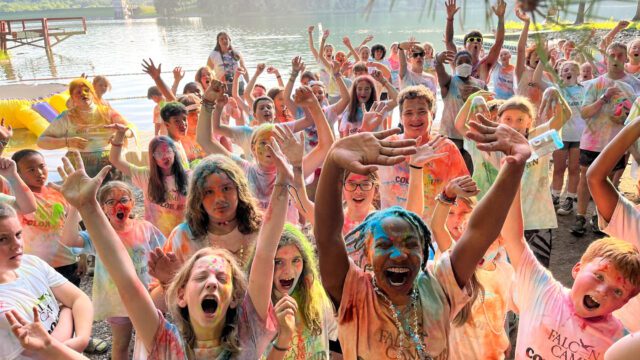 Excited campers covered in colored powdered