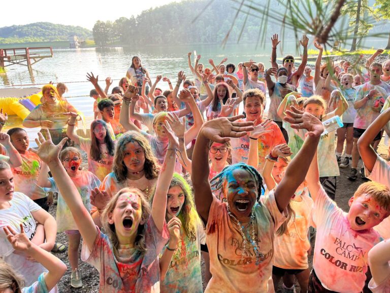 Excited campers covered in colored powdered