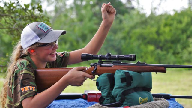 Girl shooting a rifle