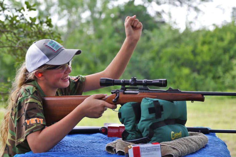 Girl shooting a rifle