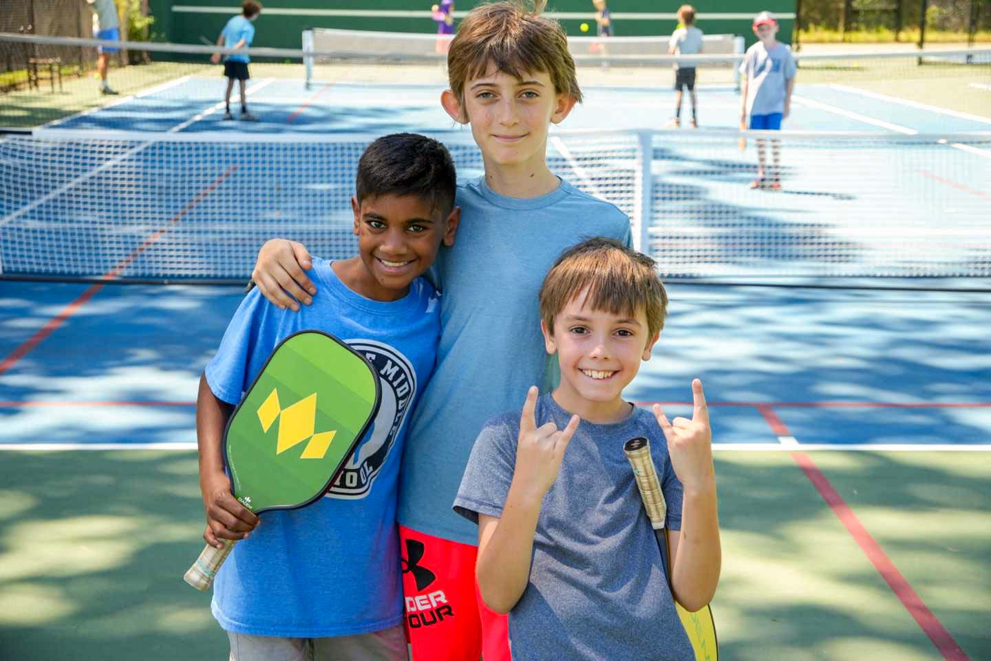 Happy boys on pickleball court