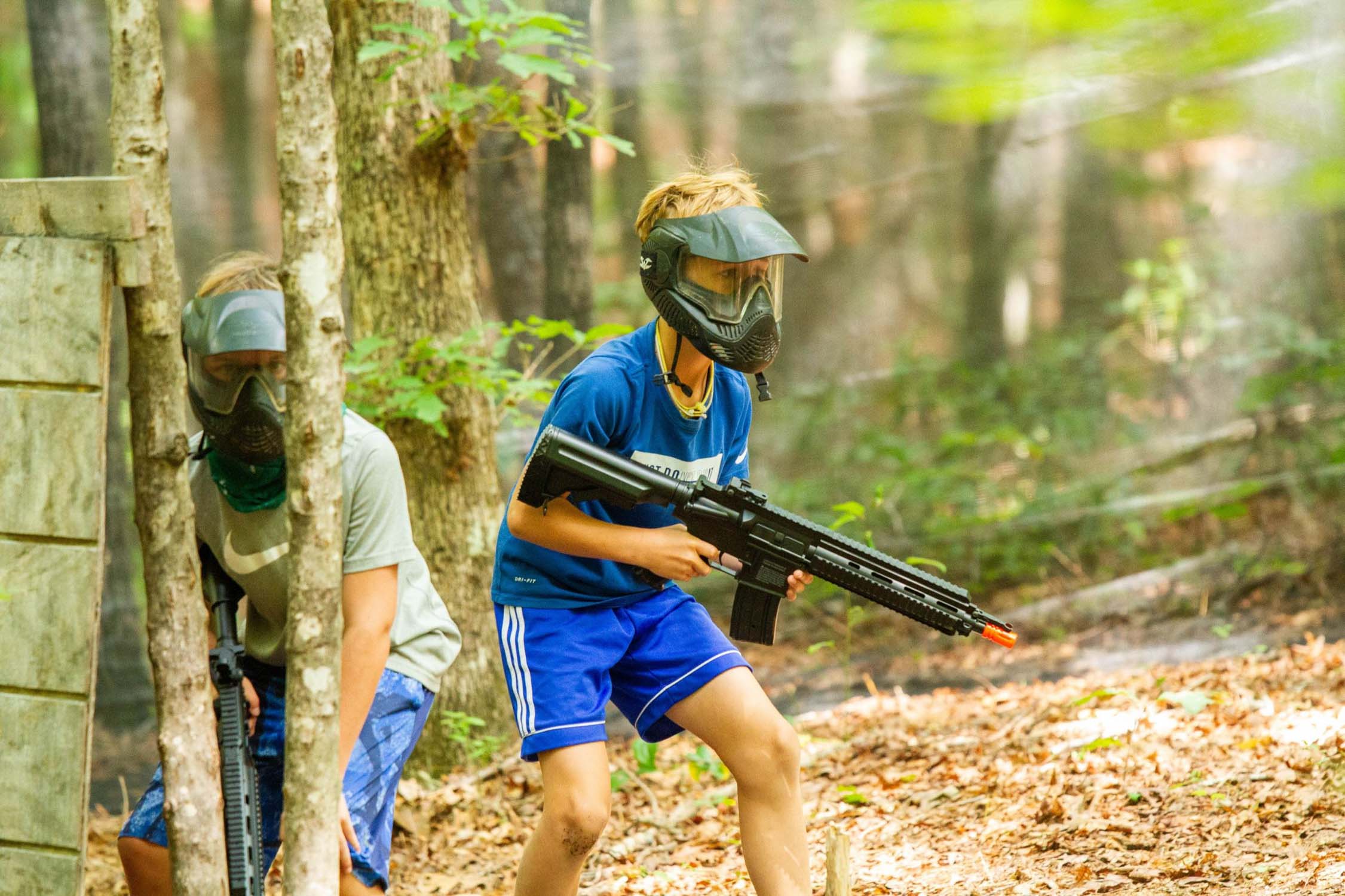 Boys airsoft game in the forest