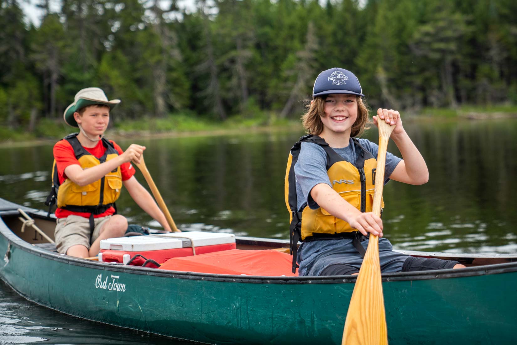 Joyful boys on canoe trip