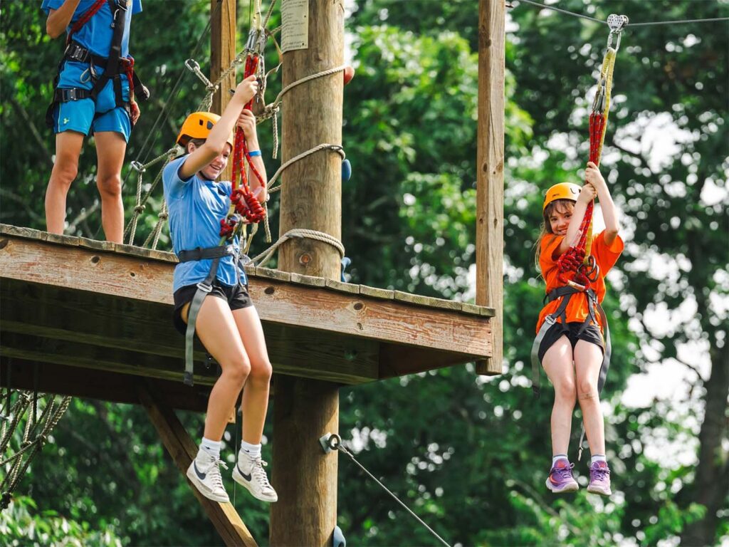 Girls on dual zip lines
