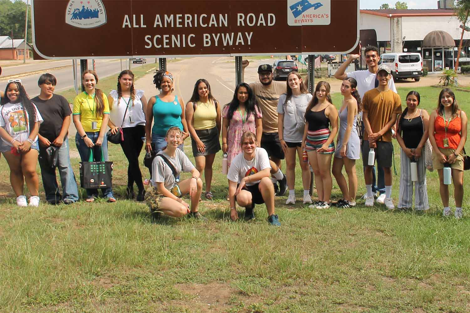 Activist campers by road sign
