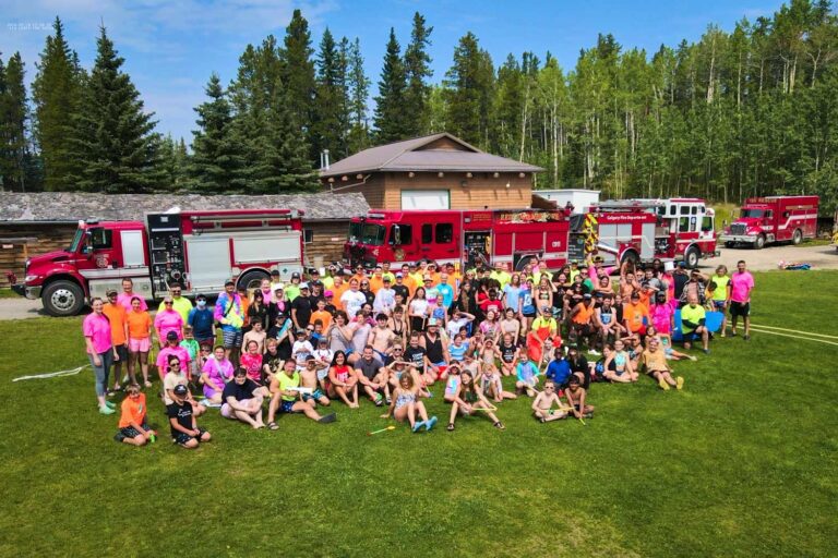 Group of campers near firetrucks