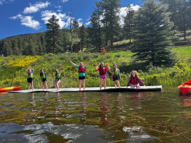Campers playing on floating water mat