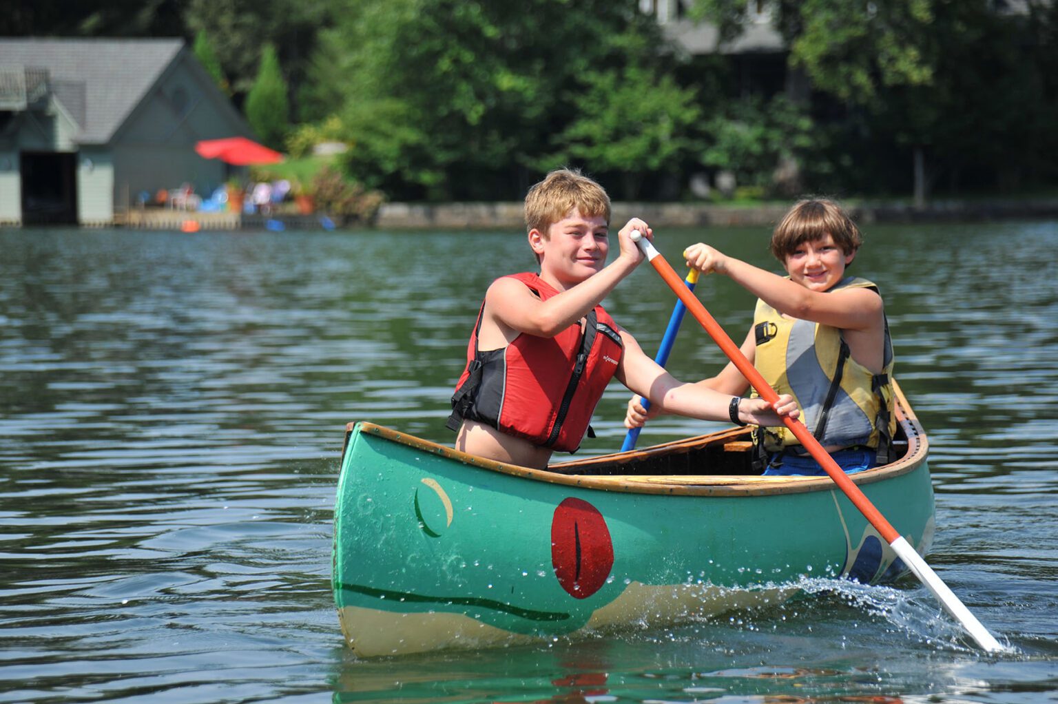 Two happy boys in a canoe
