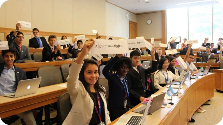 Model UN campers holding up signs with their nation names
