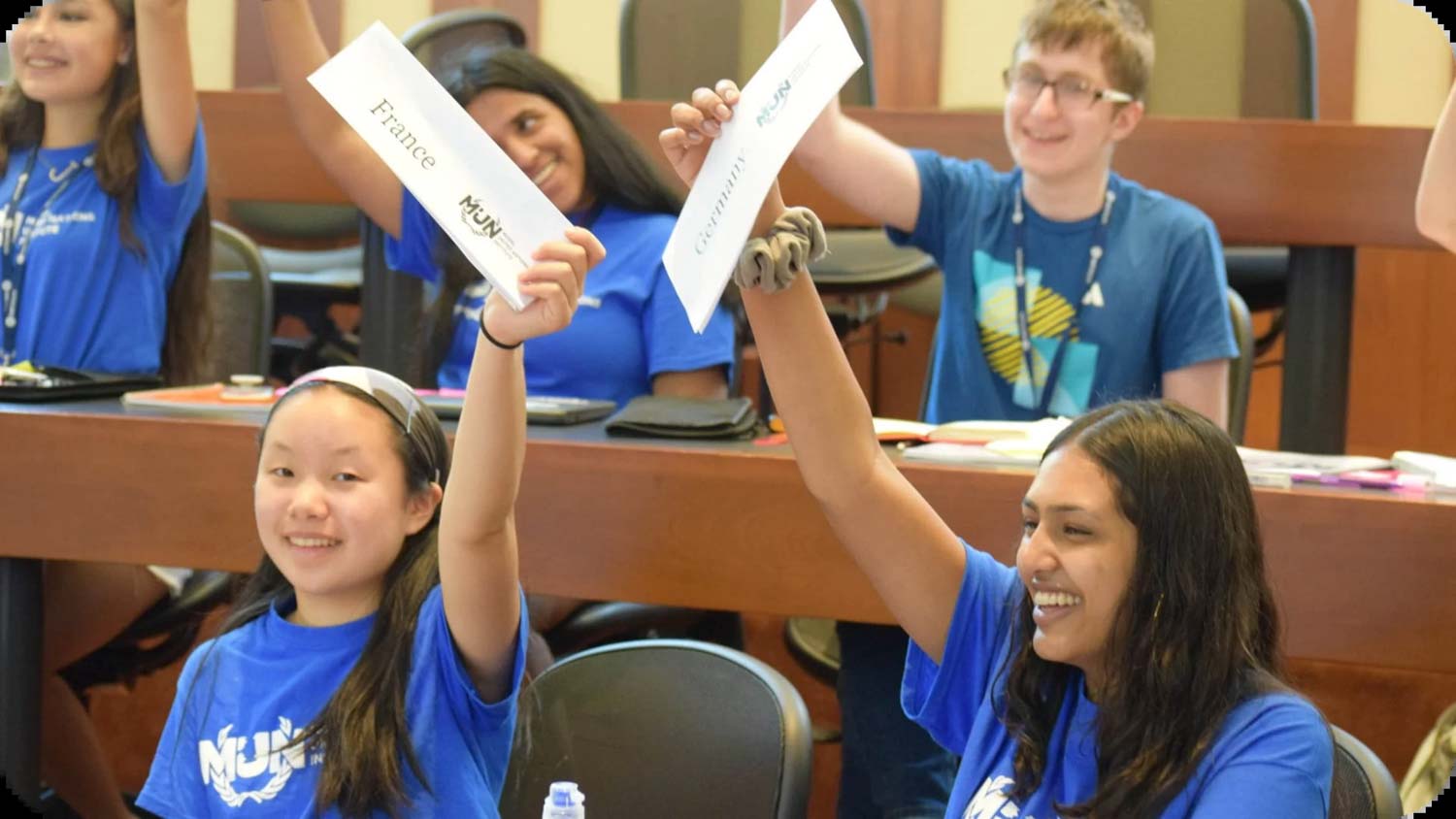 Debate campers holding up nation signs