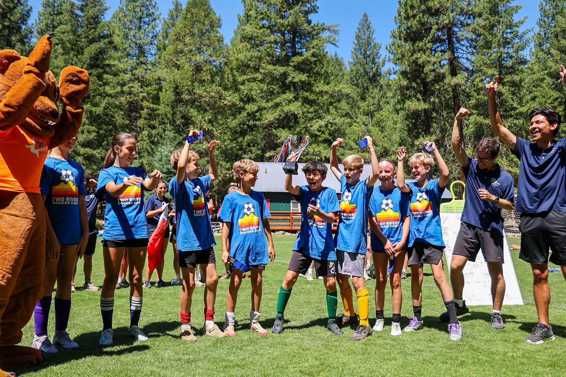 Soccer campers celebrating a win
