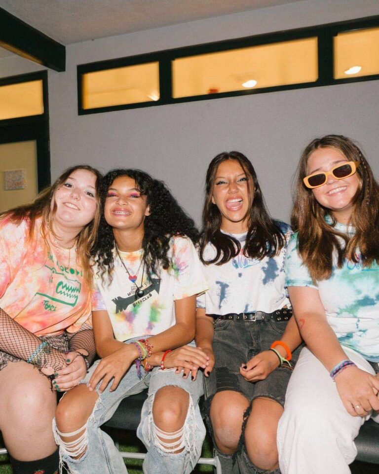 Joyful teen girls smiling at the camera